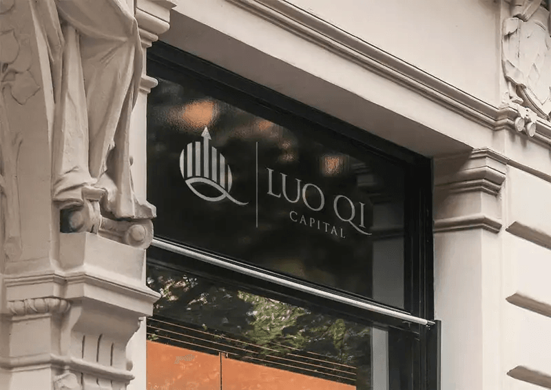 Luo Qi Capital logo displayed on a storefront window of a classic stone building.