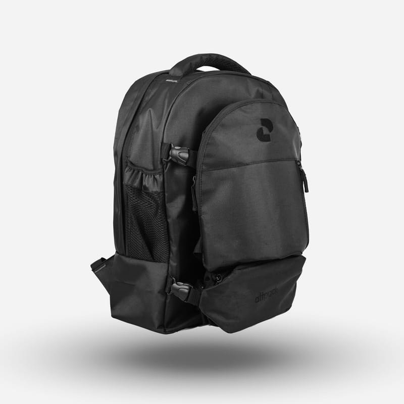 A heavy-duty black backpack with multiple compartments and side buckles floating against a white background.