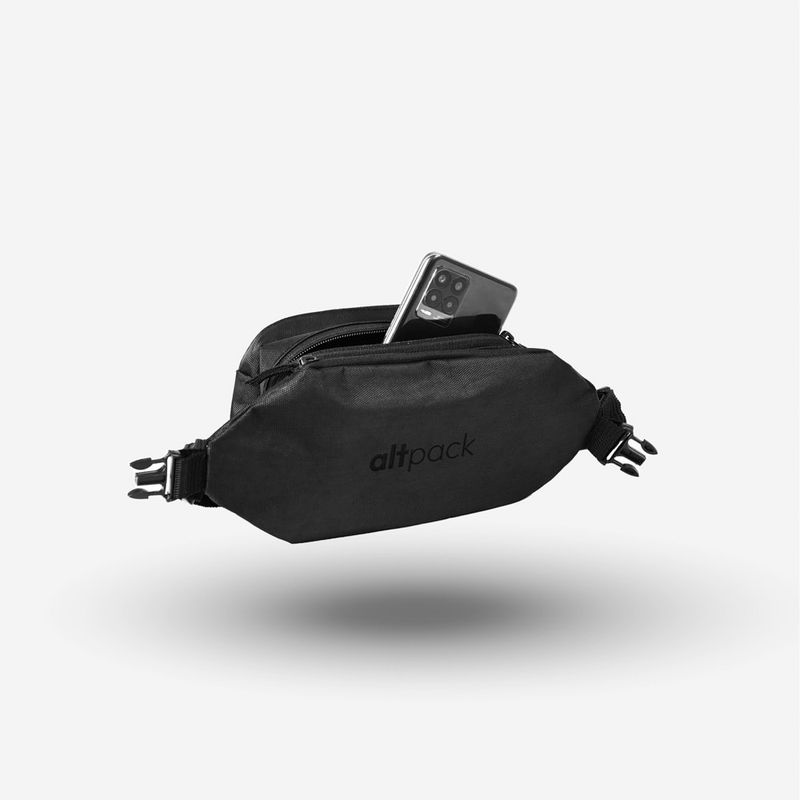A black Altpack waist bag floating against a white background with a smartphone inside.