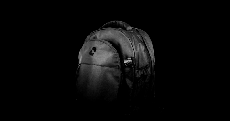 Black backpack with a logo on the front pocket, angled against a black background.