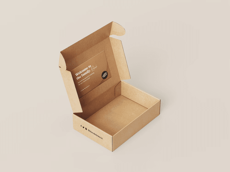 An open brown cardboard mailing box with custom branding on the inner lid.