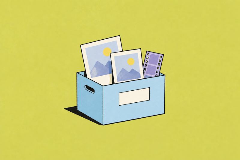 A blue archive box holds two photographs and a short filmstrip.